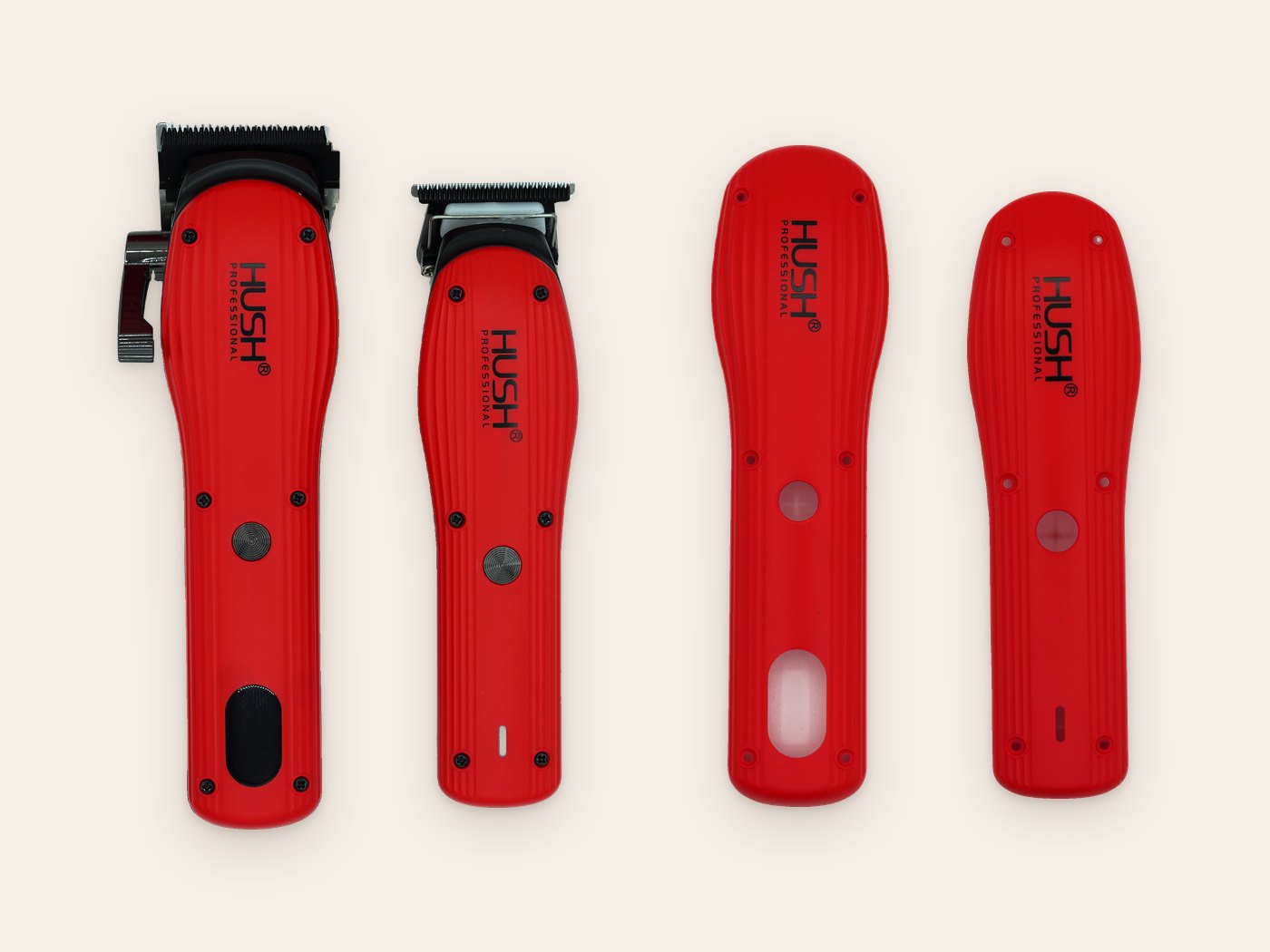 HUSH Clipper and Trimmer in red next to the two red face plates, one for each tool